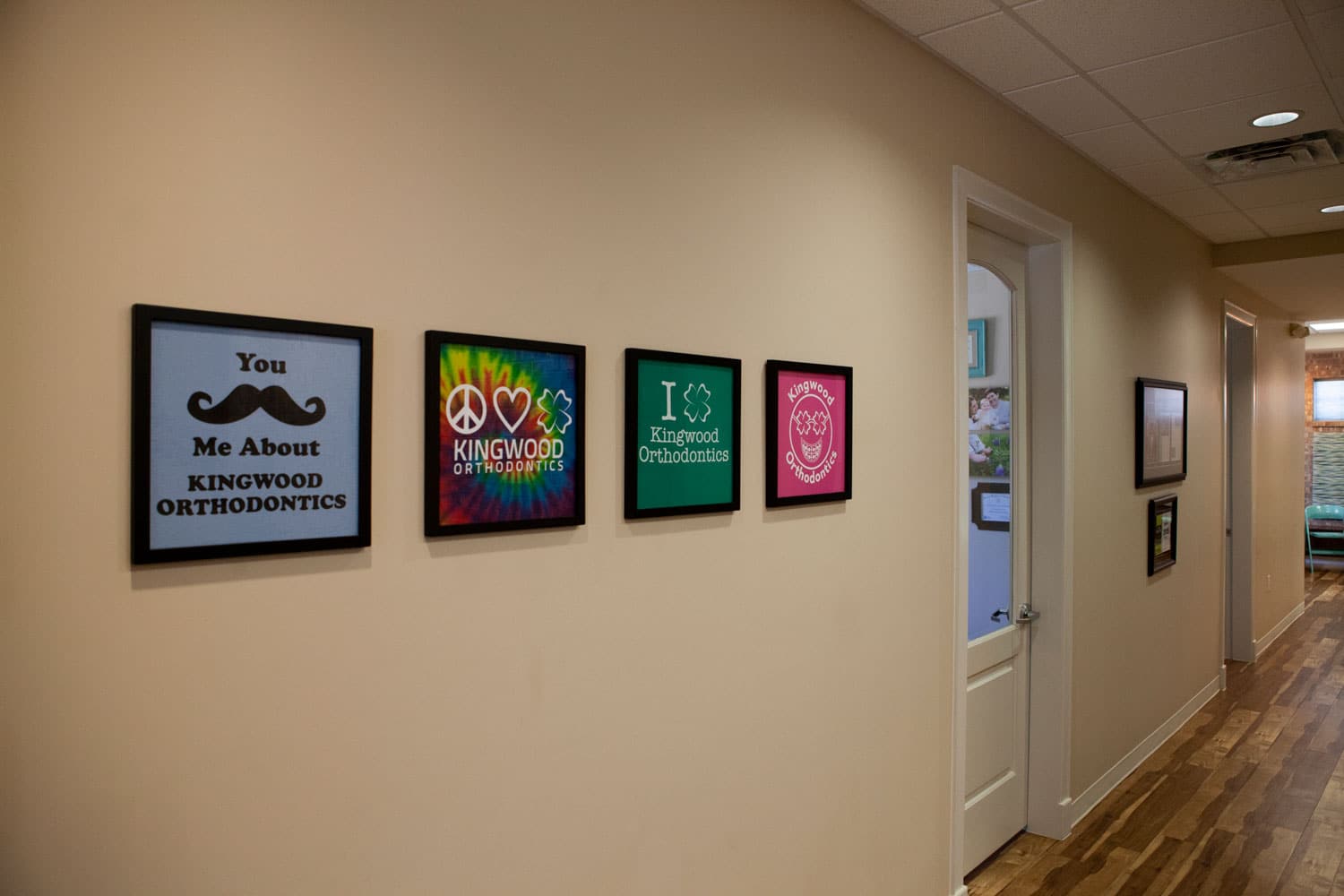 frames on the wall in the office