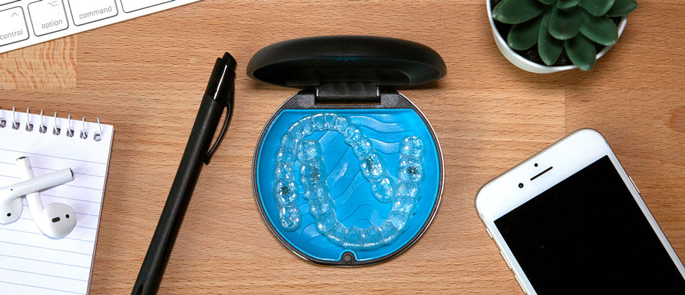 messy desk with invisalign
