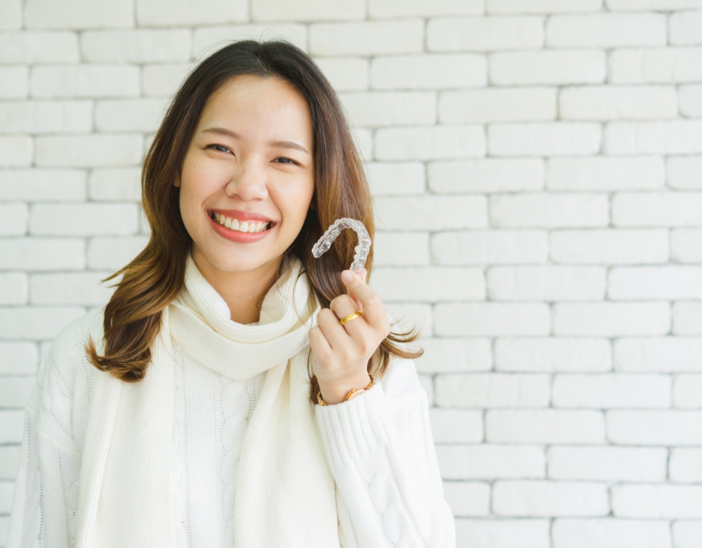 woman smiling with Invisalign